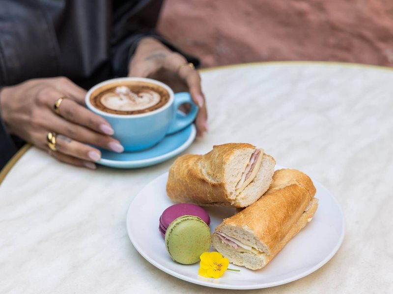 Baguette sandwich, coffee and two macarons